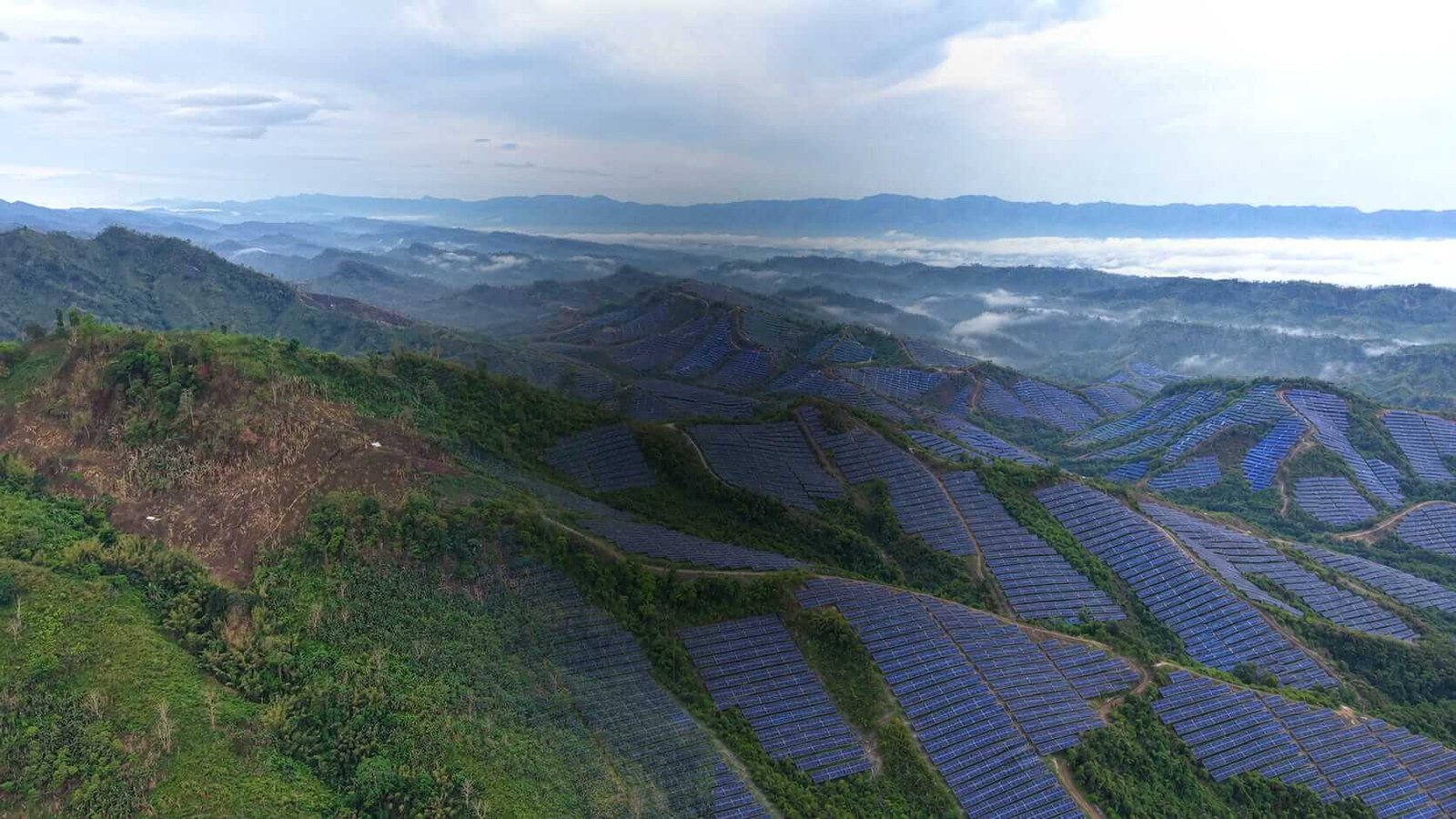 Solar installations across a mountain landscape